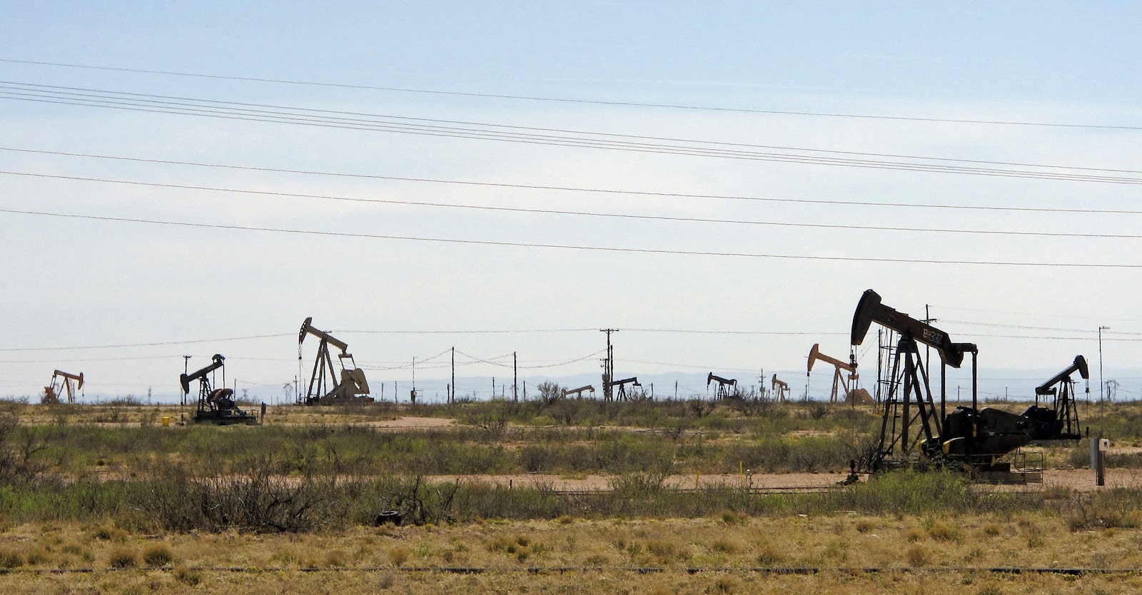 A photo of New Mexico's oil rigs in a field.